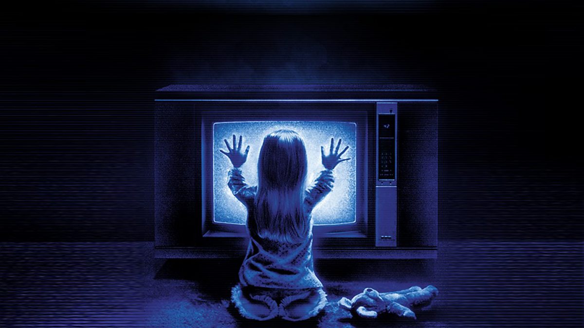 Original Poster of Poltergeist where little girl has her hands on buzzing TV